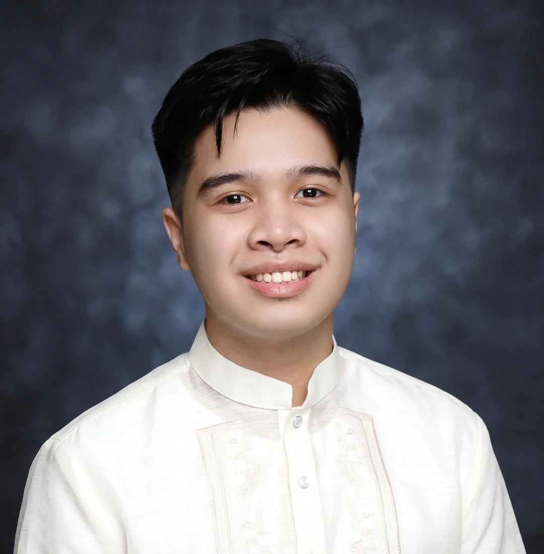 Carl smiling in a white barong
